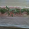 Rotolo di sfoglia con pancetta,sottilette e rucola in preparazione